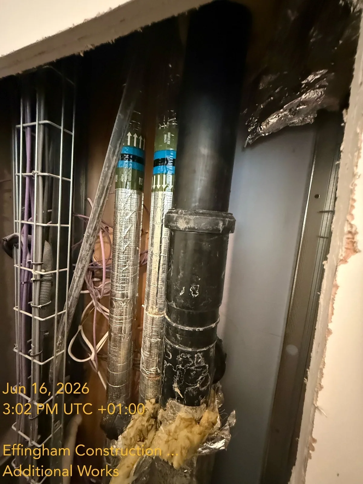 Wastewater pipework exposed in a service void at Dockley Apartments