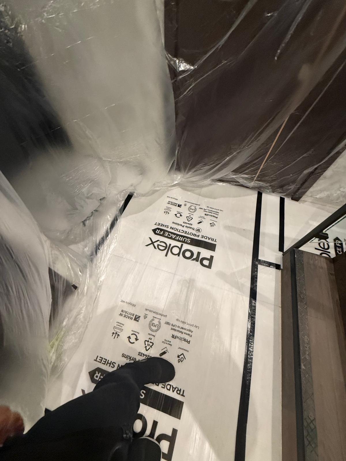 Floor protection beside enclosed finishes during Nine Elms pool and spa ceiling works